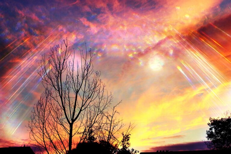 Divine golden light rays breaking through the sky