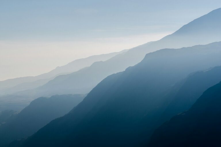 Misty mountains glowing at sunrise